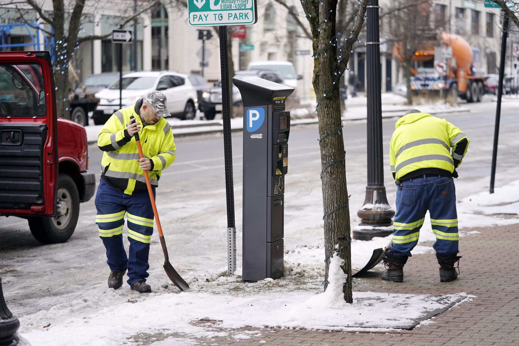 Men shovel ice